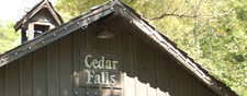 Real Estate in Cedar Falls cabin rental resort in Pigeon Forge. Picture of bridge at entrance of Cedar Falls