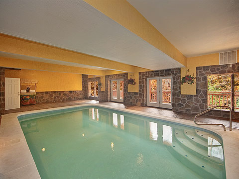 Indoor Pool Lodge - Luxury Pigeon Forge cabin rental with indoor pool, home theater room, and just minutes from the Parkway in Pigeon Forge.
